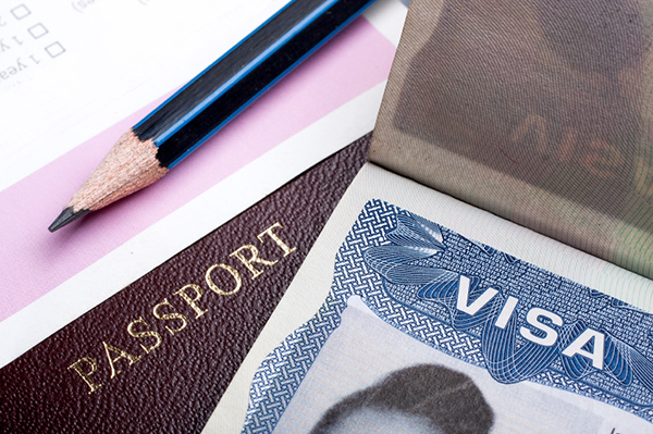 Passport and US visa background with immigration application form.